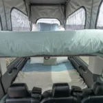 The interior view of the Del Mar's two interior beds with bedding. 