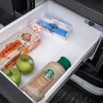 The refrigerator in the Del Mar campervan with groceries. 