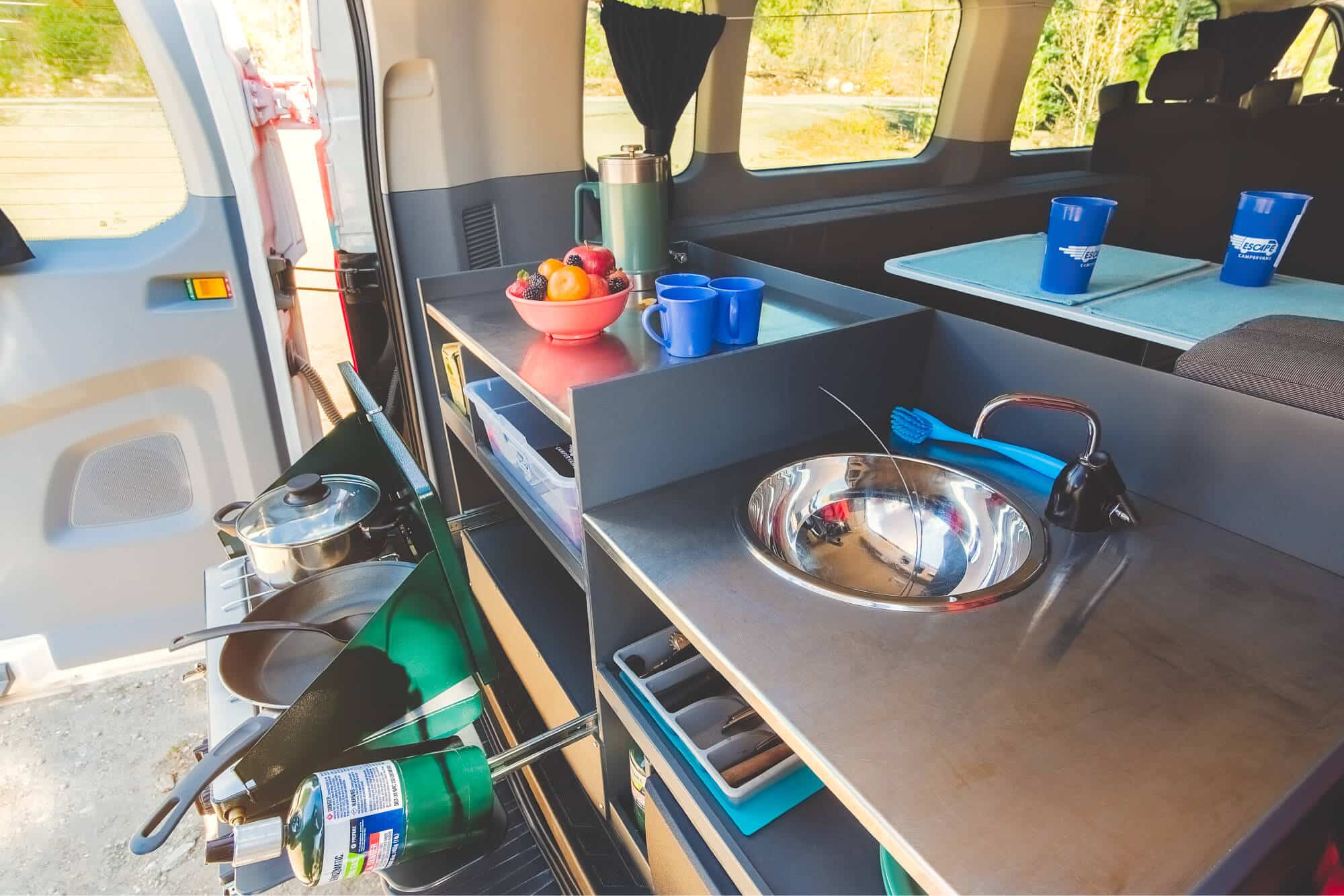 Escape Camper Vans all come with a kitchen with a 5 gallon water tank.