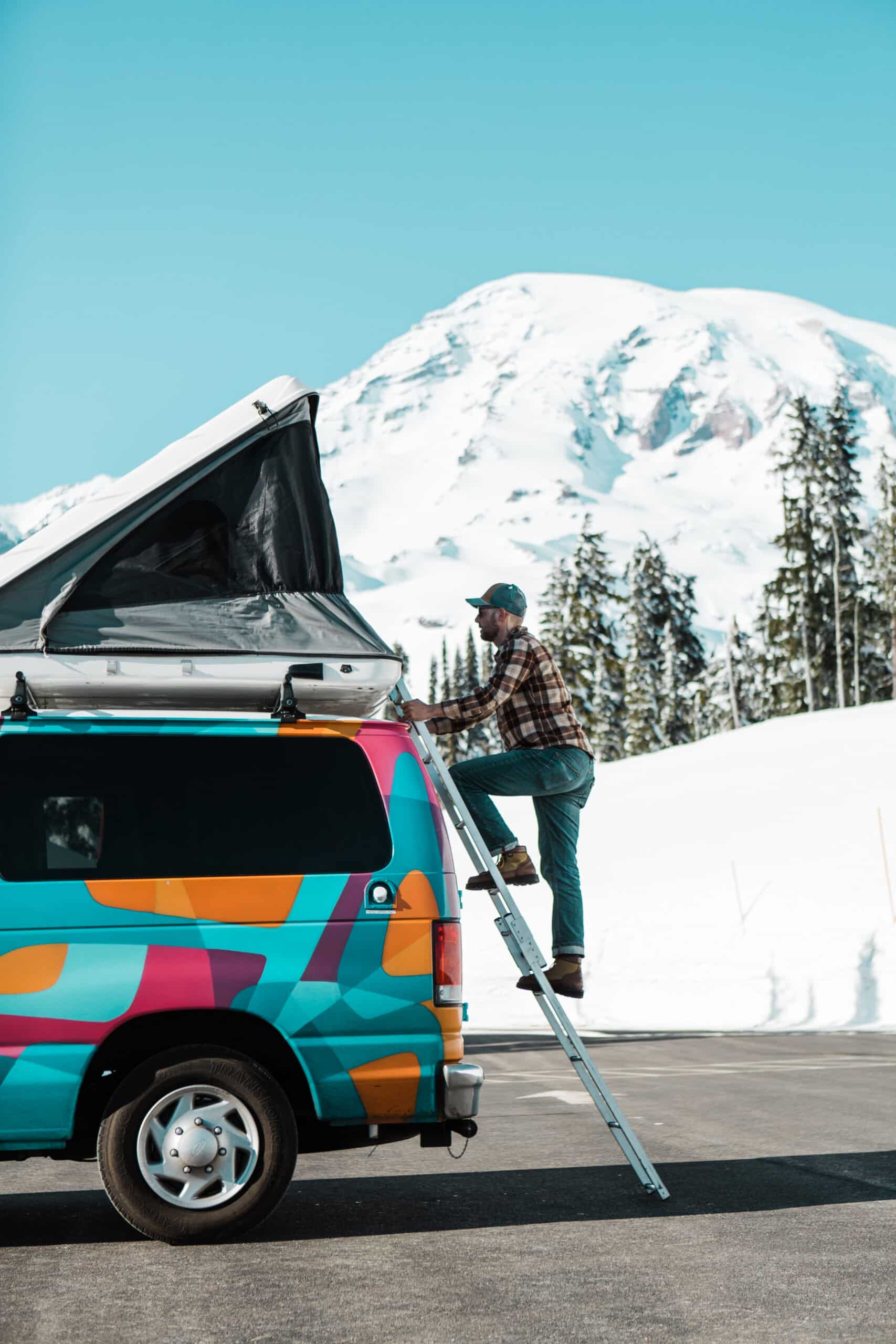 man climbing into a campervan