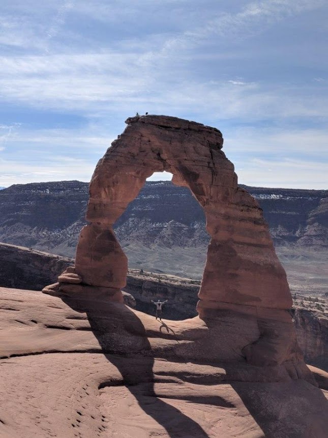 A photo of Delicate Arch in Arches National Park on a denver road trip.