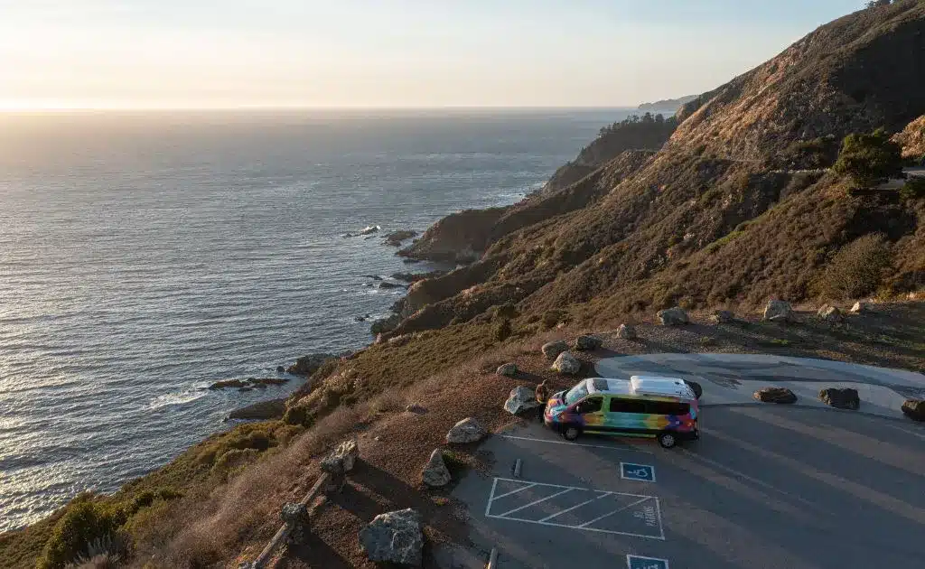 an escape camper van parked on the california coast
