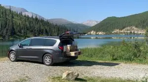 Voyager camper by a lakeside campsite